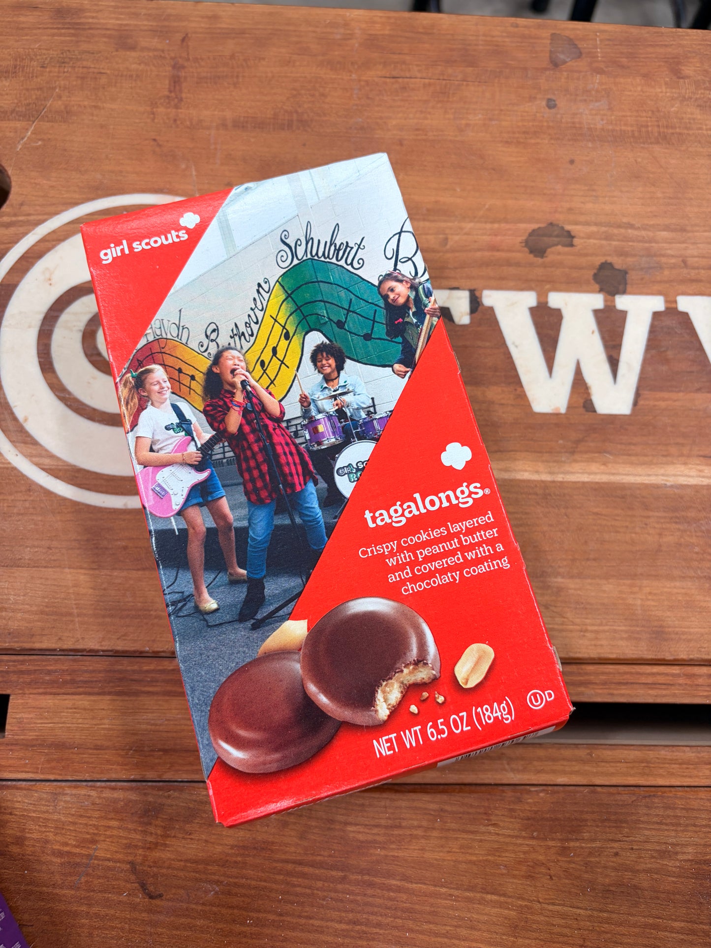 Tagalong cookie package on a wooden table with a visible brand logo.