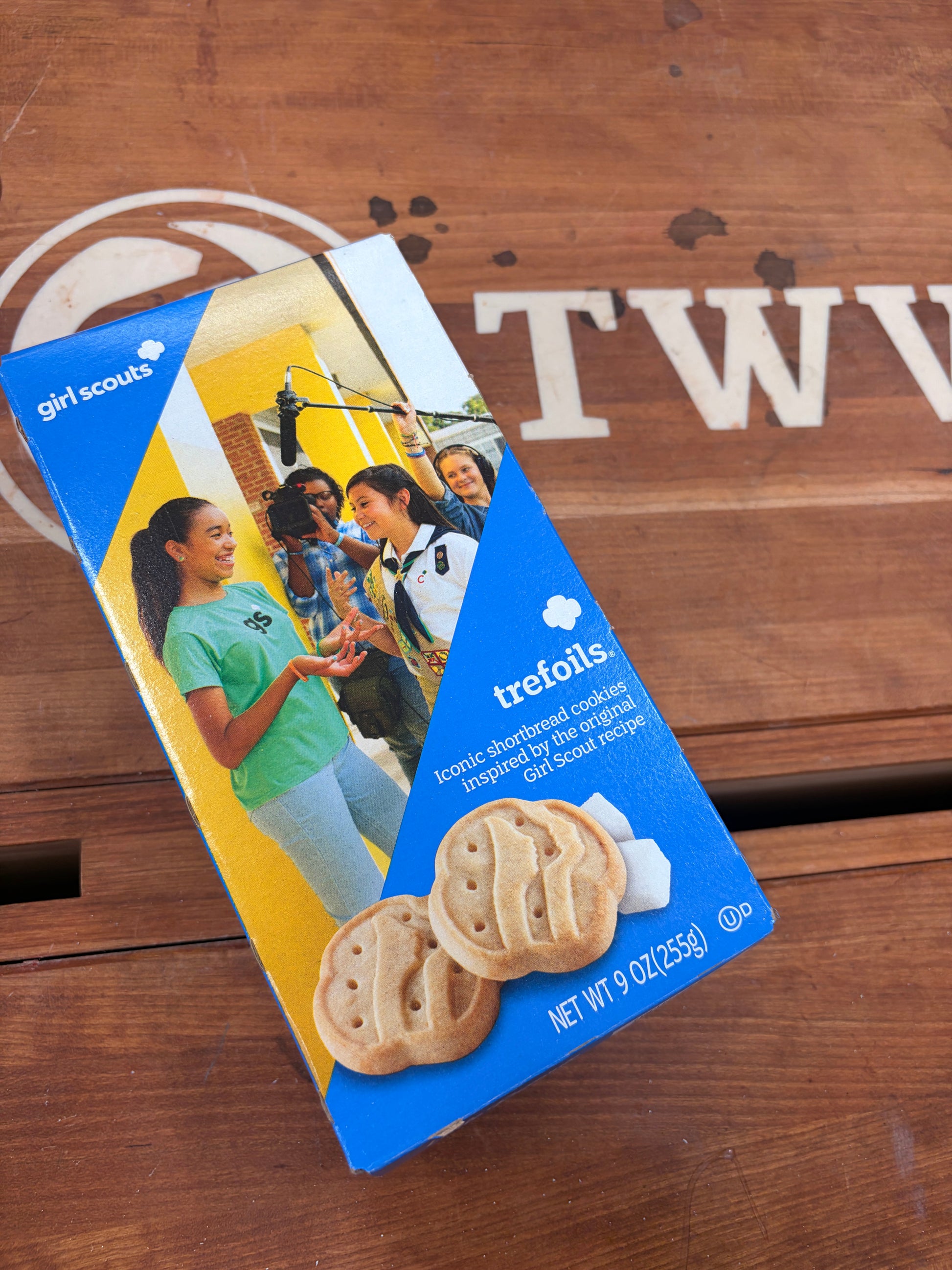 Trefoils cookie package on a wooden surface with 'TWW' branding.